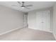 Spacious bedroom with neutral walls, carpet, ceiling fan, and closet at 408 W Stallings St, Clayton, NC 27520