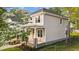 Charming home with a metal roofed front porch and manicured landscaping at 408 W Stallings St, Clayton, NC 27520