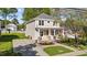 Charming two-story home featuring a welcoming front porch, fresh landscaping, and a well-manicured lawn at 408 W Stallings St, Clayton, NC 27520