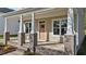 Inviting front entrance with a wooden door and brick-based pillars at 408 W Stallings St, Clayton, NC 27520