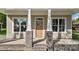 Inviting front entrance with a wooden door and brick-based pillars at 408 W Stallings St, Clayton, NC 27520