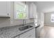 Kitchen sink with granite countertops, stainless steel appliances, and ample cabinet space at 408 W Stallings St, Clayton, NC 27520