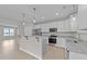 Modern kitchen features stainless steel appliances, granite countertops, and island at 408 W Stallings St, Clayton, NC 27520