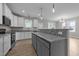 Bright and airy kitchen with white cabinetry, granite countertops, and stainless appliances at 408 W Stallings St, Clayton, NC 27520