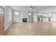 Open-concept living room featuring a fireplace and view into the kitchen at 408 W Stallings St, Clayton, NC 27520