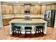 A gourmet kitchen with an island, granite countertops, stainless steel appliances, and hardwood floors at 4405 Brighton Ridge Dr, Apex, NC 27539