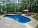 Backyard features a refreshing in-ground pool, perfect for relaxation and entertaining at 4405 Brighton Ridge Dr, Apex, NC 27539