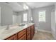Bathroom featuring a double vanity and a large mirror at 4509 Joe Cotton Dr, Knightdale, NC 27545