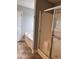 Bright bathroom featuring a shower and tub with tile floors and white wall paint at 4509 Joe Cotton Dr, Knightdale, NC 27545
