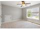 Cozy bedroom with a ceiling fan and natural light from the window at 4509 Joe Cotton Dr, Knightdale, NC 27545