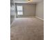 Neutral bedroom with carpet flooring, a window and neutral-toned walls at 4509 Joe Cotton Dr, Knightdale, NC 27545