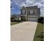 Charming two-story home featuring a wide driveway and attached two-car garage at 4509 Joe Cotton Dr, Knightdale, NC 27545