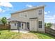 Two-story home exterior featuring a patio, a well-maintained lawn, and mature trees at 4509 Joe Cotton Dr, Knightdale, NC 27545