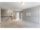 Open hallway with carpet flooring, white railing, and neutral paint at 4509 Joe Cotton Dr, Knightdale, NC 27545