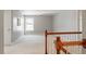 Bright hallway featuring neutral walls and carpeted floors at 4509 Joe Cotton Dr, Knightdale, NC 27545