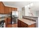 Spacious kitchen with stainless steel refrigerator, lots of cabinets, and great counter space at 4509 Joe Cotton Dr, Knightdale, NC 27545