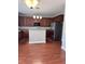 Open kitchen featuring wood cabinets, stainless steel appliances and central island at 4509 Joe Cotton Dr, Knightdale, NC 27545