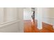Bright living room featuring hardwood floors, white trim, and an open floorplan at 4509 Joe Cotton Dr, Knightdale, NC 27545