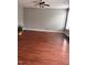 Spacious living room with wood floors, ceiling fan and view of the backyard at 4509 Joe Cotton Dr, Knightdale, NC 27545