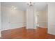 An expansive living room featuring hardwood floors, white trim and neutral walls at 4509 Joe Cotton Dr, Knightdale, NC 27545