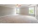Large primary bedroom with tray ceiling and multiple windows at 4509 Joe Cotton Dr, Knightdale, NC 27545
