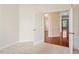 Home office features an open glass paneled door, carpet floors and light walls at 4509 Joe Cotton Dr, Knightdale, NC 27545