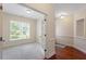 Home office featuring large windows, light walls, and glass paneled door at 4509 Joe Cotton Dr, Knightdale, NC 27545