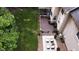 Overhead shot of a beautiful backyard with a stone patio, nice lawn, and a cozy deck with outdoor seating at 5025 Martin Farm Rd, Raleigh, NC 27613