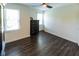 Bedroom featuring a dark wood floor, a ceiling fan and a chest of drawers at 5025 Martin Farm Rd, Raleigh, NC 27613