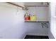 Organized closet with shelving, wooden rods and decorative baskets for optimal storage at 5025 Martin Farm Rd, Raleigh, NC 27613