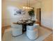 Elegant dining room with stylish lighting, wainscoting, and a beautifully set table for sophisticated gatherings at 5025 Martin Farm Rd, Raleigh, NC 27613