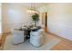 A dining room with a modern chandelier and elegant table setting at 5025 Martin Farm Rd, Raleigh, NC 27613