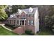 Charming brick home with black shutters and dormer windows at 5025 Martin Farm Rd, Raleigh, NC 27613