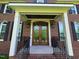 Elegant brick home featuring a beautiful, decorative glass double-door entrance with charming curb appeal at 5025 Martin Farm Rd, Raleigh, NC 27613