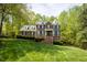 Beautiful brick home with dormer windows and a well-manicured lawn at 5025 Martin Farm Rd, Raleigh, NC 27613