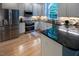 Modern kitchen with stainless steel appliances, custom cabinets, and granite countertops at 5025 Martin Farm Rd, Raleigh, NC 27613