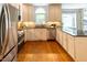 Bright and functional kitchen featuring stainless steel appliances and a large island with barstool seating at 5025 Martin Farm Rd, Raleigh, NC 27613