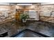 Detailed shot of a stylish kitchen countertop featuring a stone backsplash and designer decor at 5025 Martin Farm Rd, Raleigh, NC 27613