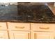 Luxurious granite countertop with custom cabinetry and elegant hardware in a modern kitchen setting at 5025 Martin Farm Rd, Raleigh, NC 27613