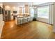 Spacious kitchen with island seating, stainless steel appliances, and hardwood flooring at 5025 Martin Farm Rd, Raleigh, NC 27613