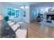 Open concept living space featuring an island with seating and a comfortable seating area with a fireplace at 5025 Martin Farm Rd, Raleigh, NC 27613