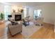 Spacious living room with fireplace, seating, and a view of the office at 5025 Martin Farm Rd, Raleigh, NC 27613