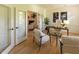 Lovely office space with French doors, hardwood floors, stylish desk, and comfortable seating at 5025 Martin Farm Rd, Raleigh, NC 27613