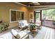 Relaxing screened-in porch with comfortable seating, outdoor view and wood-paneled ceiling at 5025 Martin Farm Rd, Raleigh, NC 27613