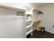 Well-organized walk-in closet with shelving, wooden rods, and ample storage space at 5025 Martin Farm Rd, Raleigh, NC 27613