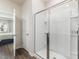 Bathroom featuring a large glass shower and view into the bedroom at 648 White Birch Ln, Angier, NC 27501