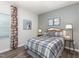Cozy bedroom with a unique, dog-themed decor and ample natural light at 648 White Birch Ln, Angier, NC 27501