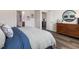 Nicely appointed bedroom with a dresser, decorative mirror, and views into other rooms at 648 White Birch Ln, Angier, NC 27501