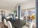 Elegant dining area with an adjacent living room, leading to an outdoor patio at 648 White Birch Ln, Angier, NC 27501