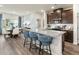Open-concept kitchen with granite counters, stainless steel appliances, and adjacent dining area at 648 White Birch Ln, Angier, NC 27501
